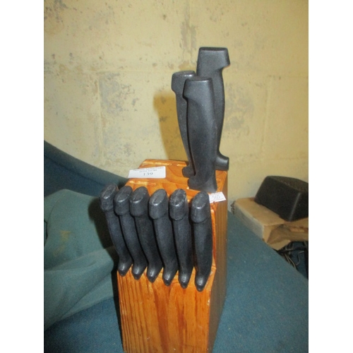 139 - WOODEN KNIFE BLOCK WITH 9 KNIVES