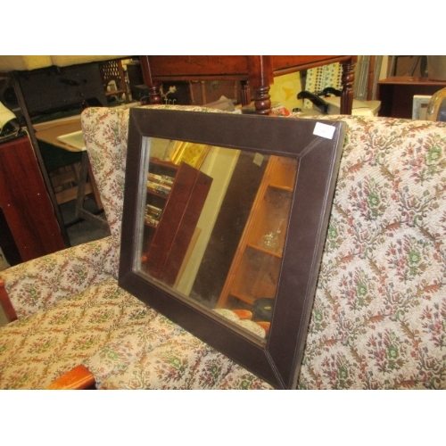 360 - A BROWN LEATHER LOOK FRAMED MIRROR