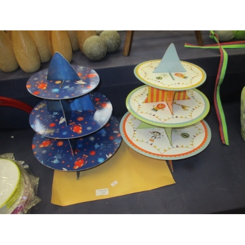 331 - 2 3 TIER CARDBOARD CHILDRENS CAKE STANDS, ONE HAS ZOO THEME AND ONE HAS SPACE THEME PLUS 3 ROLLS OF ... 