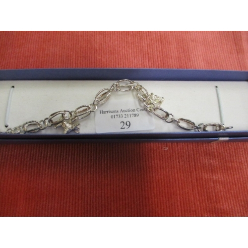 31 - SILVER COLOURED OPEN LINK BRACELET WITH 2 CHARMS DOG AND HORSES HEAD