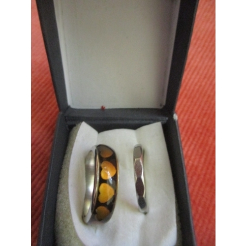 16 - 2 WEDDING BAND STYLE RINGS ONE THREE PENNY BIT STYLE THE OTHER HAS INSET HEART PATTERN