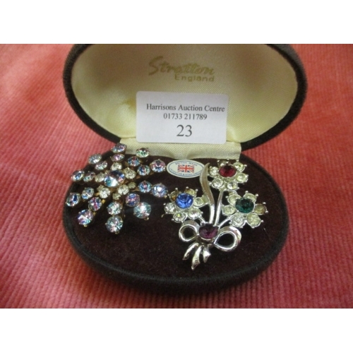 23 - 2 BROOCHES ONE IN THE SHAPE OF BOUQUET OF FLOWERS WITH RED, BLUE, GREEN, PURPLE AND WHITE  STONES AN... 