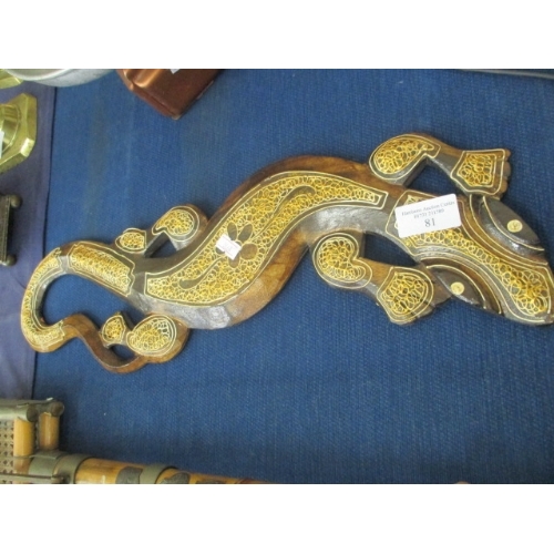 81 - A WOODEN DECORATIVE WALL PLAQUE IN THE SHAPE OF A SALAMANDER