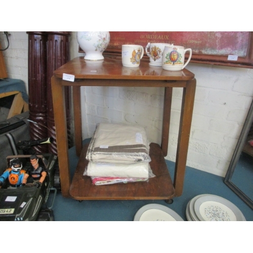 176 - 2 TIER TABLE IN BURR VENEER WITH CASTERS