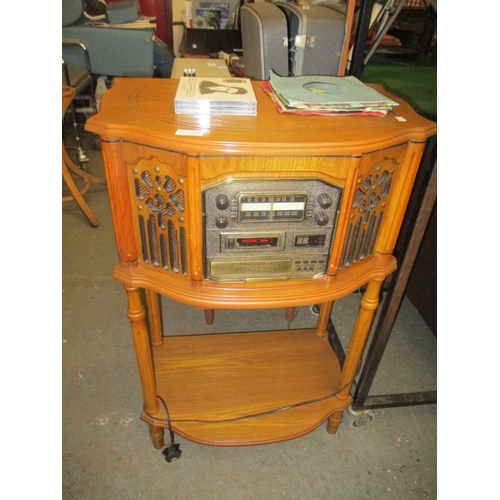 307 - OAK CASED VINTAGE LOOK RECORD / CD PLAYER WITH 3 ELVIS CD'S AND SINGLES