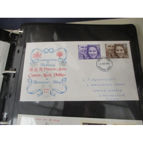 107 - A BROWN FAUX LEATHER ALBUM OF MIXED TOPIC FIRST DAY COVERS