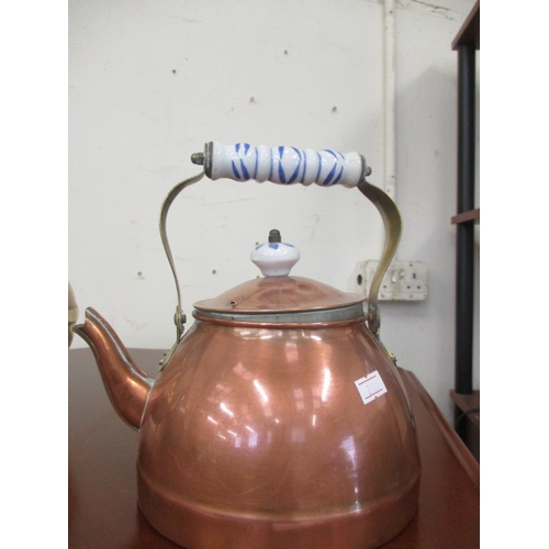 67 - BRASS KETTLE ON FEET AND COPPER KETTLE WITH DELFT HANDLE