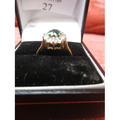 27 - 9CT GOLD RING WITH A GREEN CENTRE STONE SURROUNDED BY CLEAR STONES, SIZE L