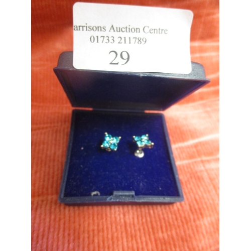 29 - A PAIR OF STUD EARRINGS WITH TURQUOISE COLOURED STONES