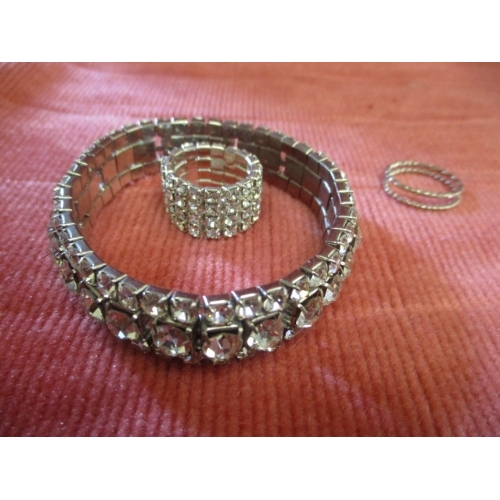 48 - DIAMANTE BRACELET AND RING PLUS 2 OTHER SILVER COLOURED TWISTED RINGS