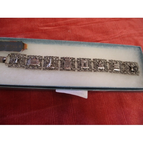 49 - SILVER COLOURED FILIGREE BRACELET DEPICTING FAMOUS FRENCH MONUMENTS INCLUDING EIFFEL TOWER, MONTMART... 