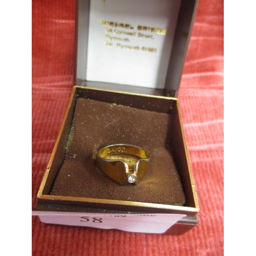 58 - A GOLD COLOURED RING WITH WHITE STONE BY AVON SIZE N