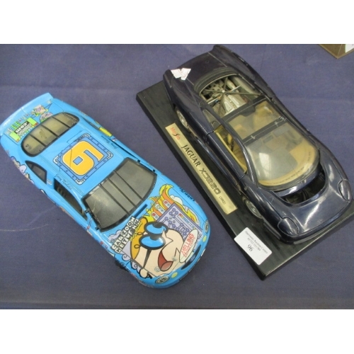 175 - JAGUAR XJ220 MODEL AND A CARTOON ADVERTISING NETWORK RACE CAR MODEL