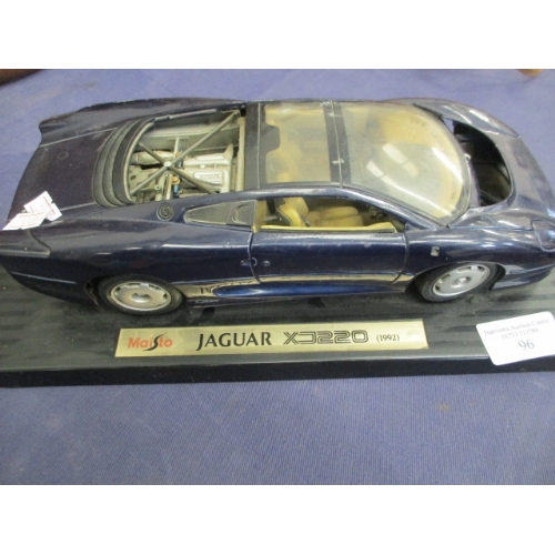 175 - JAGUAR XJ220 MODEL AND A CARTOON ADVERTISING NETWORK RACE CAR MODEL