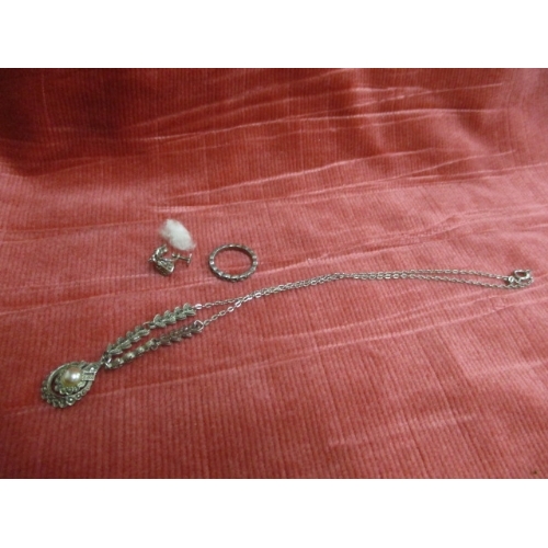 44 - SILVER COLOURED NECKLACE RING AND SINGLE CLIP ON EARRING WITH PEARL AND MARCASITE STONES