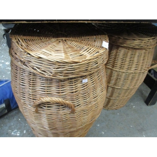 239 - 2 WICKER LAUNDRY BASKETS WITH HANDLES AND LIDS