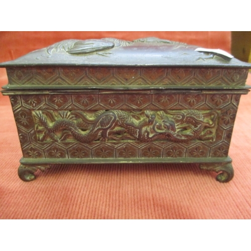 10 - BRONZE  JEWELLERY CASE WITH ORIENTAL EMBOSSED DRAGONS TO SIDES AND FRONT AND TWO FIGHTING COCKS TO T... 