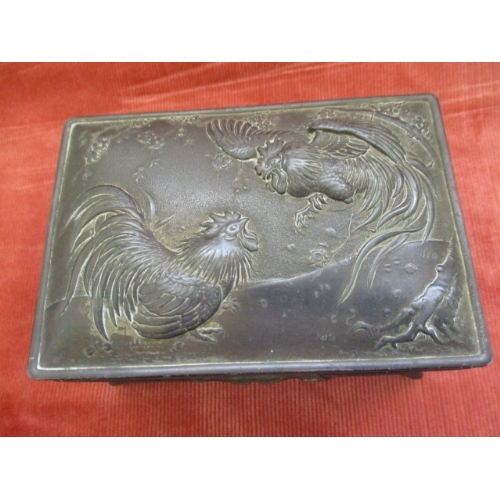 10 - BRONZE  JEWELLERY CASE WITH ORIENTAL EMBOSSED DRAGONS TO SIDES AND FRONT AND TWO FIGHTING COCKS TO T... 