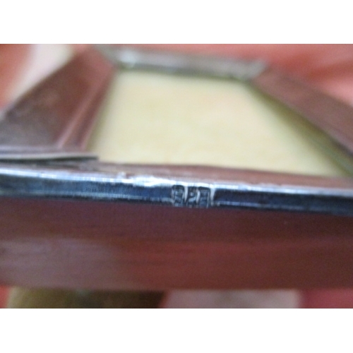 18 - SMALL WOODEN PICTURE FRAME WITH SILVER HALLMARKED SURROUND