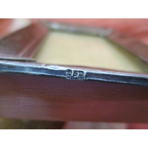 18 - SMALL WOODEN PICTURE FRAME WITH SILVER HALLMARKED SURROUND