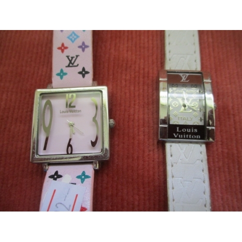 30 - 2 LADIES LOUIS VITTON STYLE WATCHES ONE WITH WHITE STRAP AND THE OTHER WITH PINK AND COLOURED STRAP