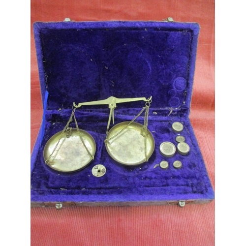 31 - SMALL BRASS WEIGHING SCALES WITH SELECTION OF 6 WEIGHTS IN CASE