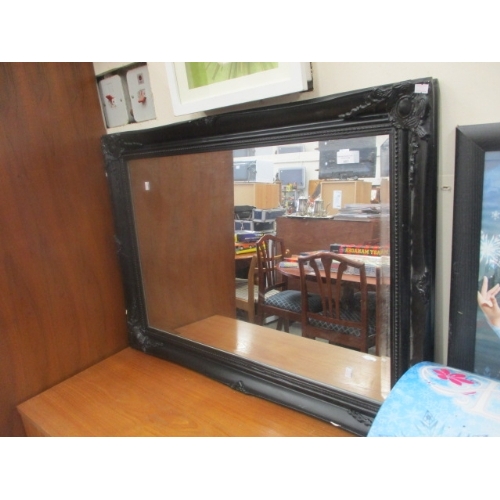 483 - LARGE BEVELLED MIRROR WITH BLACK ORNATE FRAME