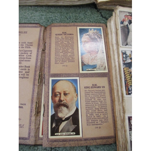 192 - 4 ALBUMS OF MIXED CIGARETTE CARDS TO INCLUDE NAVAL, FILM STARS FOOTBALLERS AND THE SILVER JUBILEE 19... 