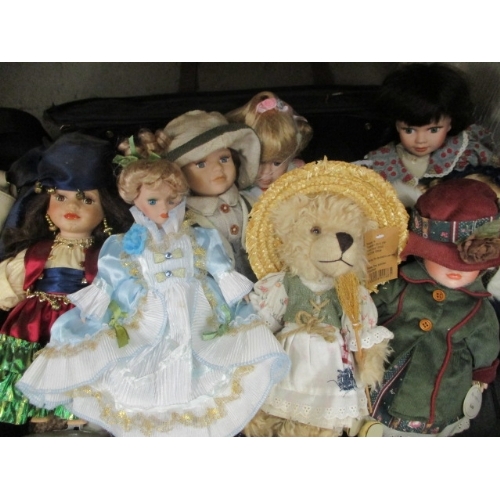 122 - SUITCASE OF MIXED DOLLS IN PRETTY DRESSES AND 2 HANDBAGS