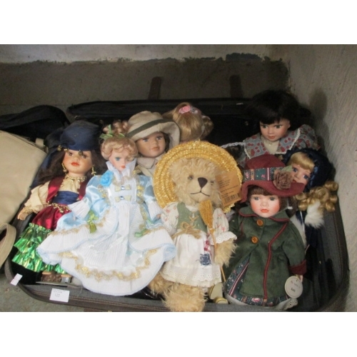 122 - SUITCASE OF MIXED DOLLS IN PRETTY DRESSES AND 2 HANDBAGS