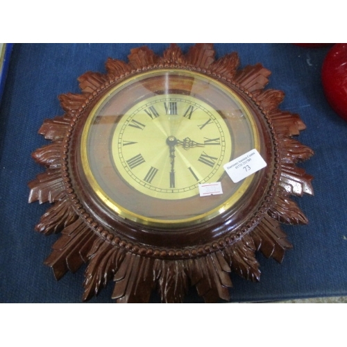 73 - A WOOD EFFECT SUN BURST WALL CLOCK