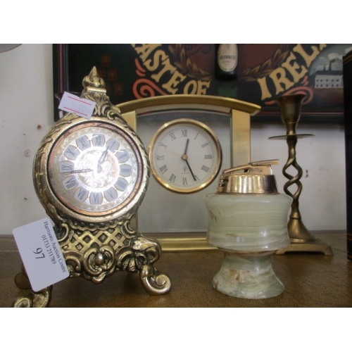 97 - SELECTION OF BRASS WARE INCLUDING CANDLE STICKS BRASS AND ONYX TABLE LIGHTER AND 2 MANTLE CLOCKS