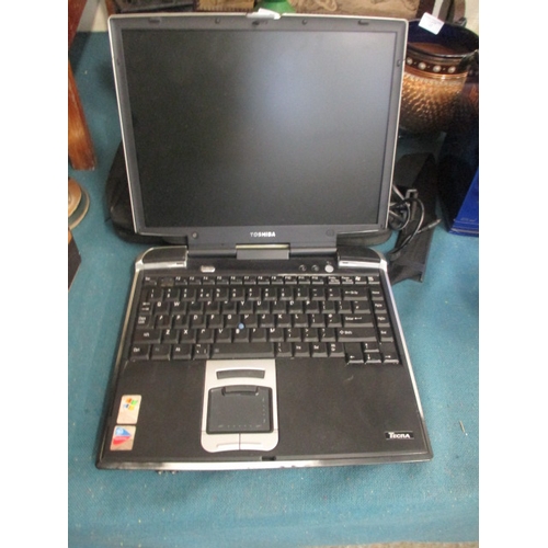 144 - TOSHIBA LAPTOP WITH CHARGER AND CASE