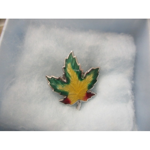 36 - STERLING SILVER AND ENAMEL MAPLE LEAF BROOCH