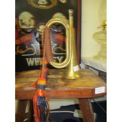 80A - A MILITARY BRASS BUGLE WITH INSIGNIA TASSLES