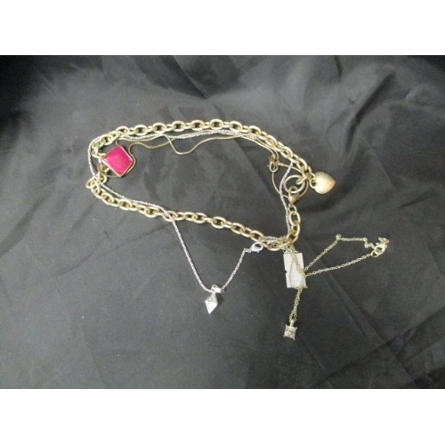 21 - SELECTION OF SILVER METAL NECKLACES