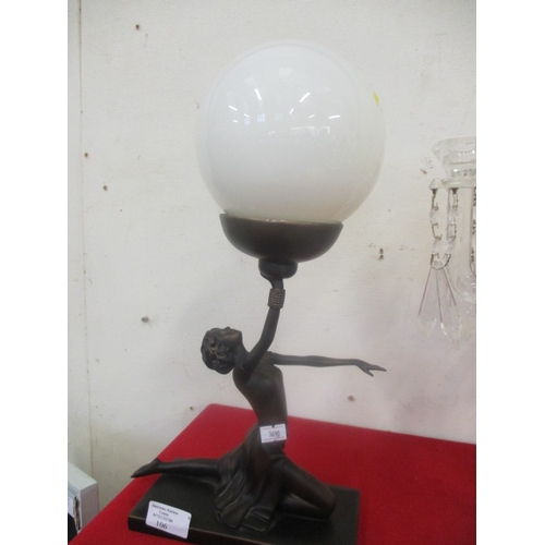 106 - ART DECO BRONZE EFFECT FIGURE HOLDING A GLASS GLOBE