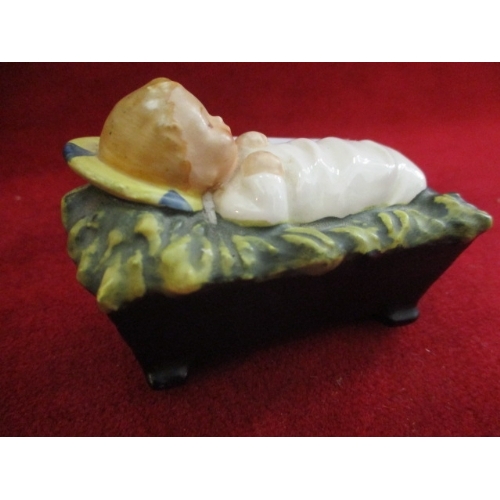 2 - CERAMIC FIGURE OF BABY JESUS IN A CRIB BY GOEBEL