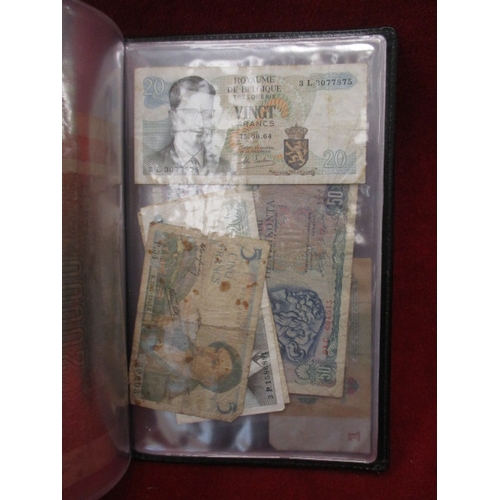 55A - 2 FOLDERS OF MIXED FOREIGN NOTES AND A £5 NOTE