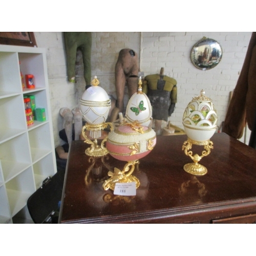 188 - SET OF 4 FABERGE STYLE EGGS ON SMALL GOLD COLOURED STANDS