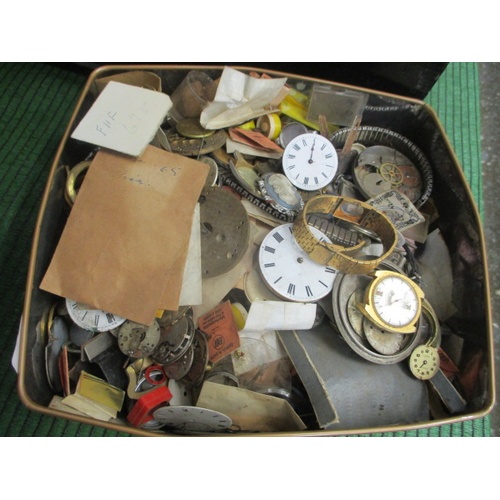 182 - BISCUIT TIN OF WATCH PARTS FOR SPARES OR REPAIRS