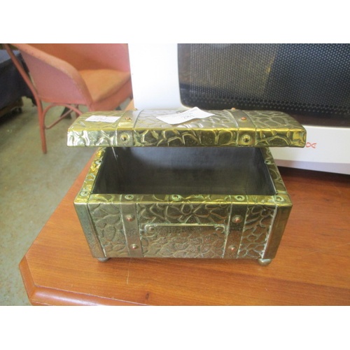 281 - A SMALL BRASS COVERED TEA CHEST