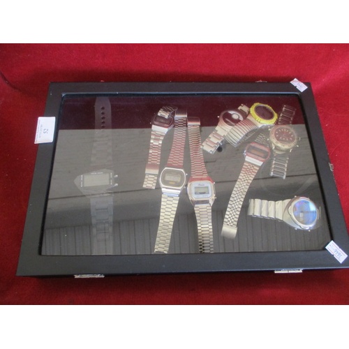 52 - DISPLAY CASE OF 9 DIGITAL GENTS WATCHES