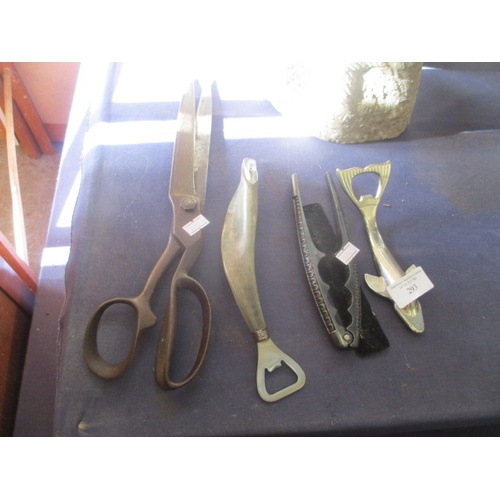 293 - 2 NOVELTY BOTTLE OPENERS, A NUT CRACKER AND A HUGE PAIR OF VINTAGE SCISSORS