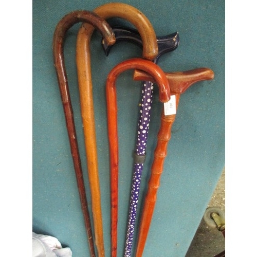 180 - 4 STURDY WALKING CANES AND A BLUE AND WHITE WALKING STICK