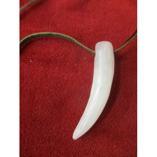 60 - WHITE JADE HAND CARVED TOOTH ON LEATHER THONG