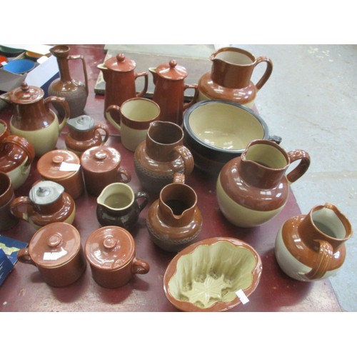 243 - COLLECTION OF BROWN POTTERY JUGS, JELLY MOULDS AND MORE