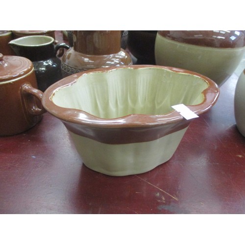 243 - COLLECTION OF BROWN POTTERY JUGS, JELLY MOULDS AND MORE