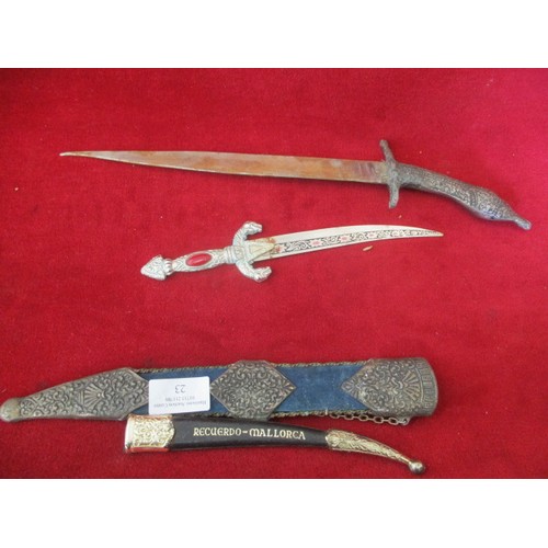 23 - LARGE DECORATIVE DAGGER IN SHEATH AND A SMALLER ONE