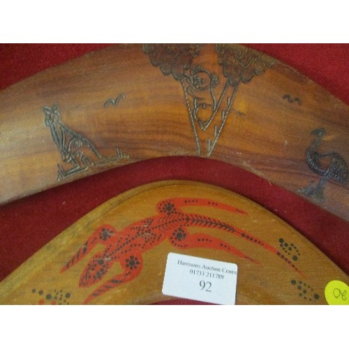 92 - 2 HAND CARVED & DECORATED WOODEN BOOMERANGS